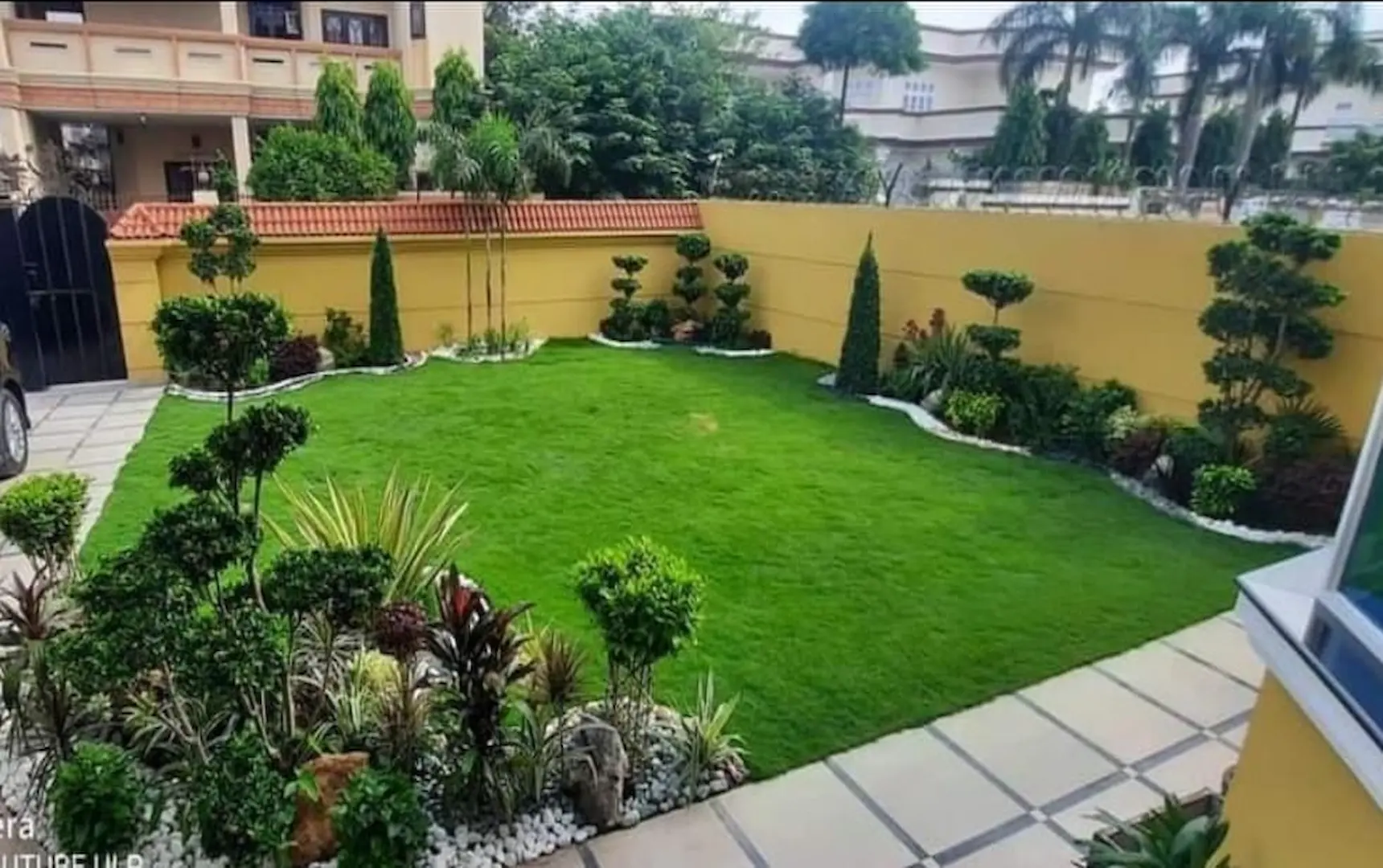 Lush estate garden with manicured hedges