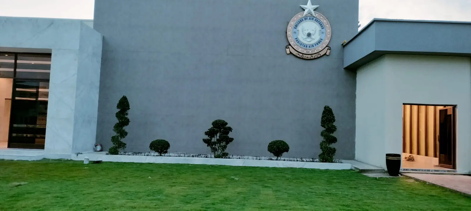 Secret garden with a central lawn and flower beds