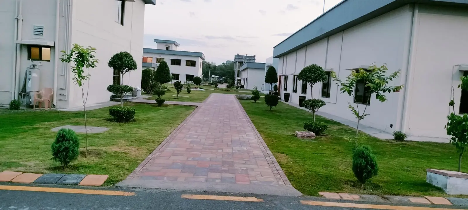 Secret garden with a central lawn and flower beds